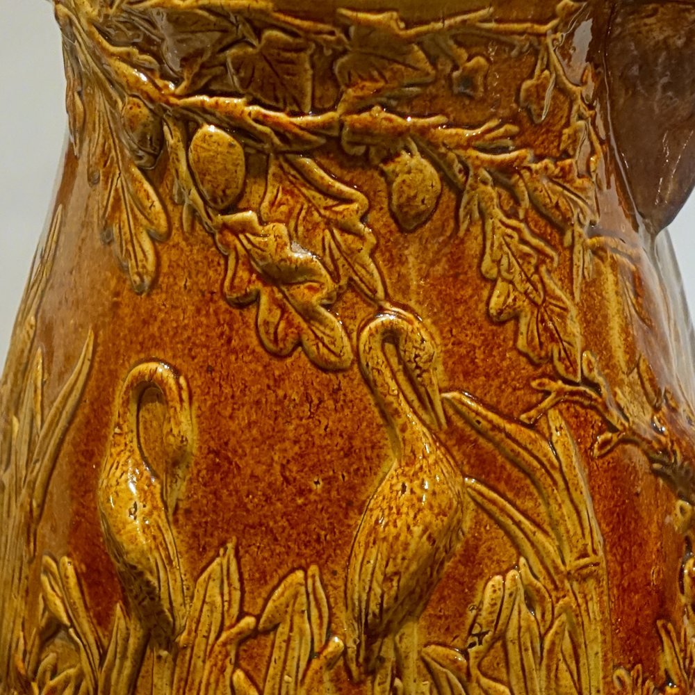 Detail of the raised leaf decoration and brown glaze on the Cap Rouge pottery jug