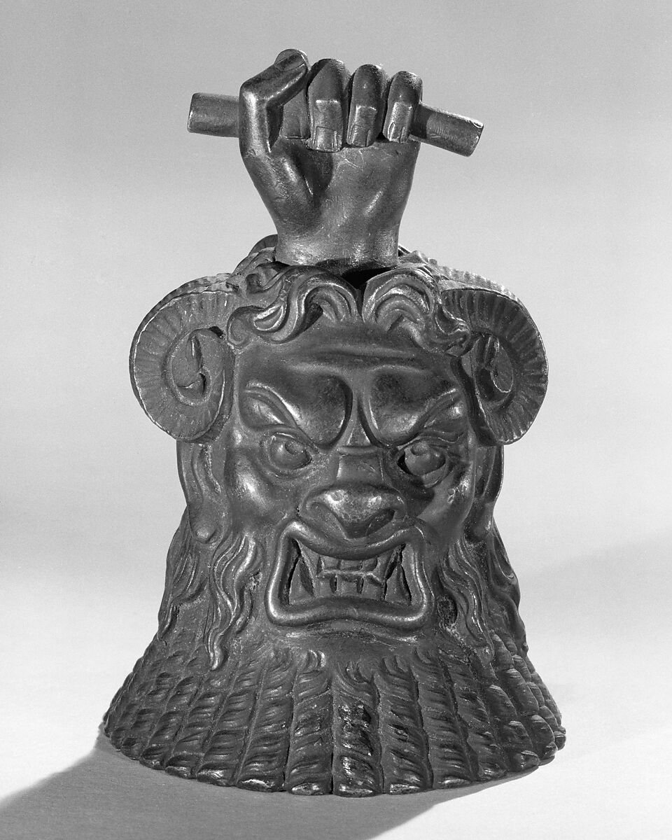 Nineteenth-century European hand bell incorporating the face of the Egyptian deity Bes.
